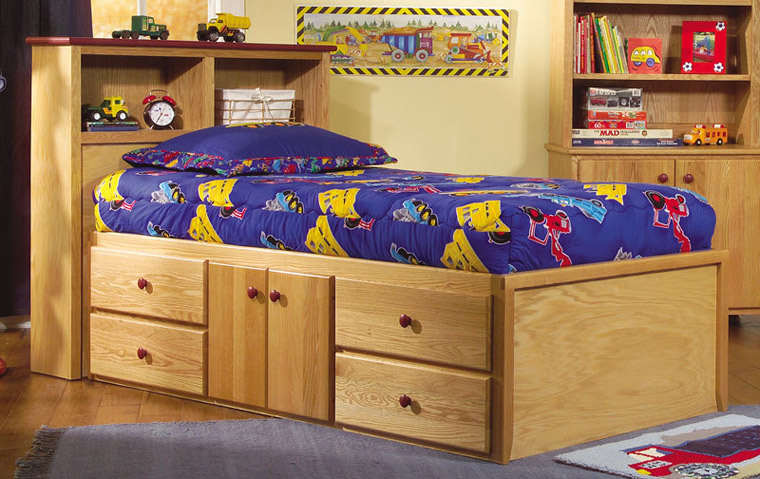 Storage bed with drawers and cupboard