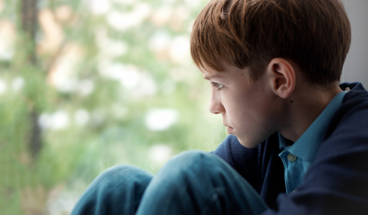 boy looking out the window