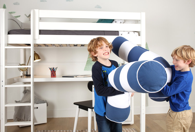 brothers pillow fighting in front of Maxtrix loft bed