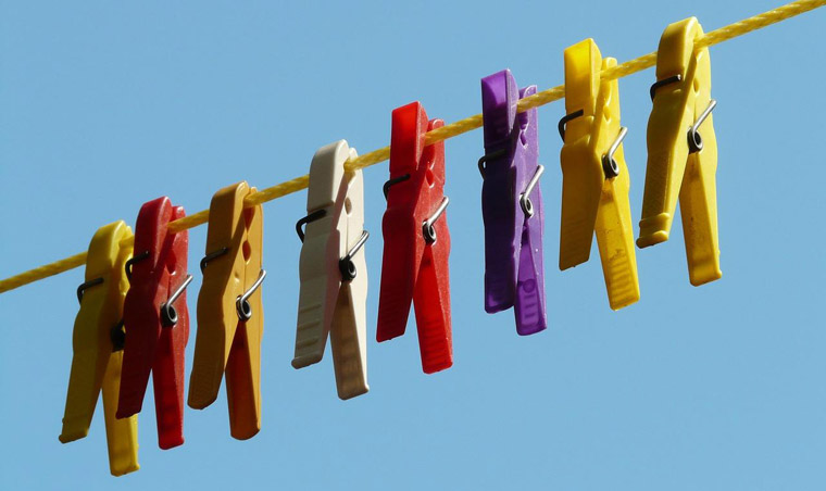 Colored clothespins on rope
