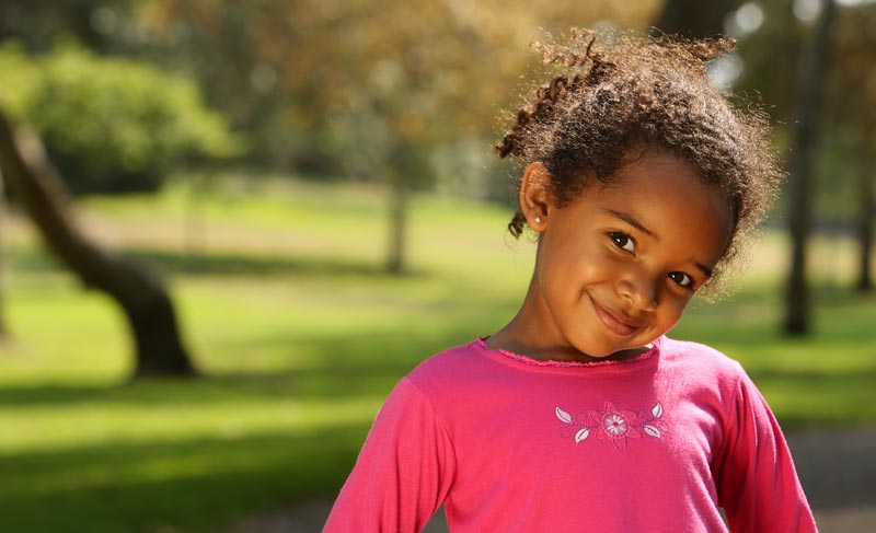 cute little girl wearing a pink shirt