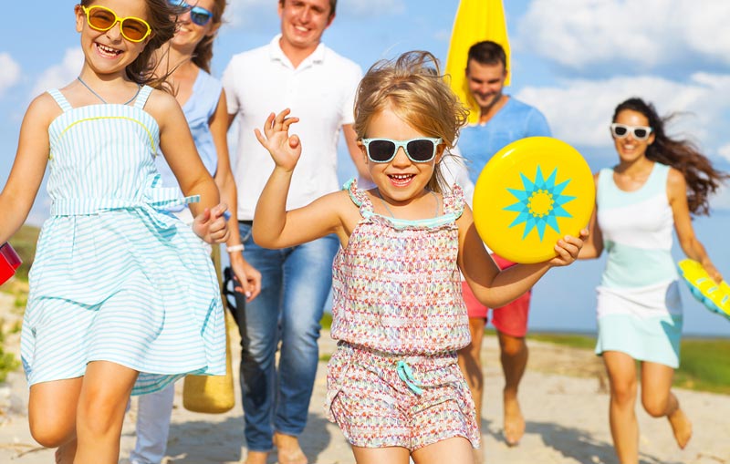 excited family going to the beach for the day