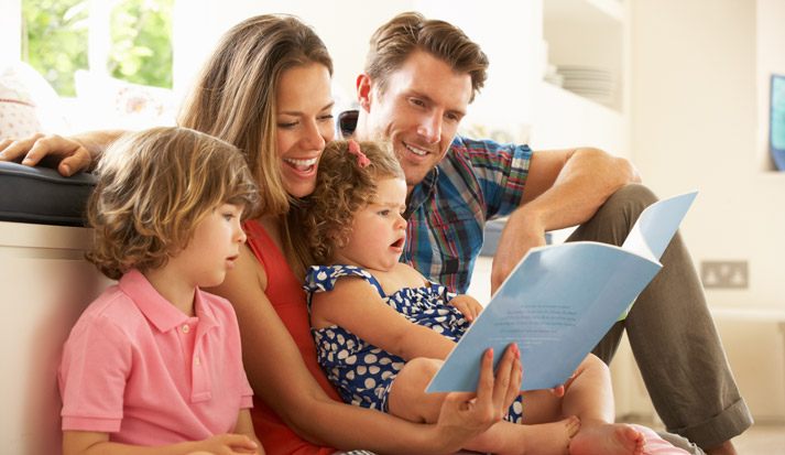 family reading a book together