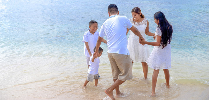 family having fun together with water