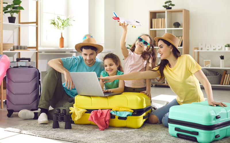 family with messy suitcases planning a fun getaway vacation