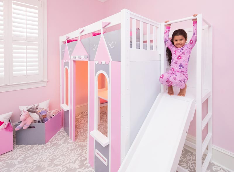girl on slide of play house with high loft Maxtrix bed
