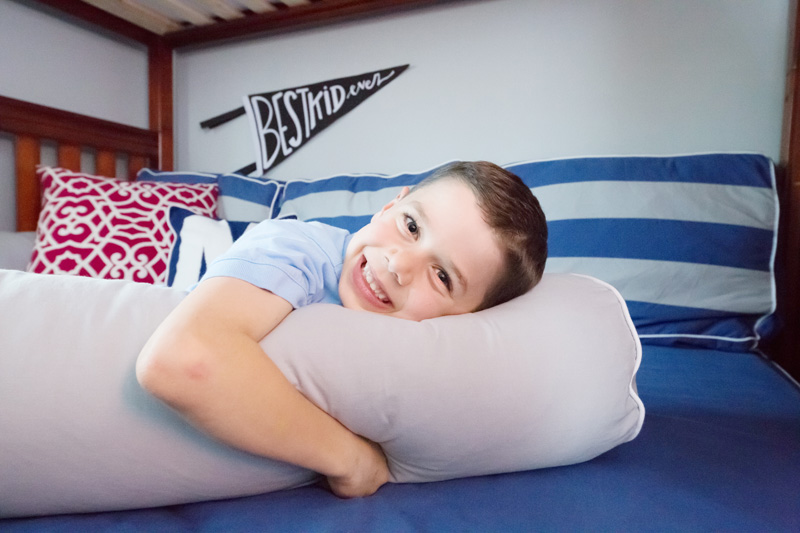 happy boy on Maxtrix corner loft bed resting