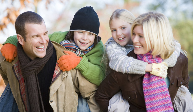 happy family warmly dressed outdoors