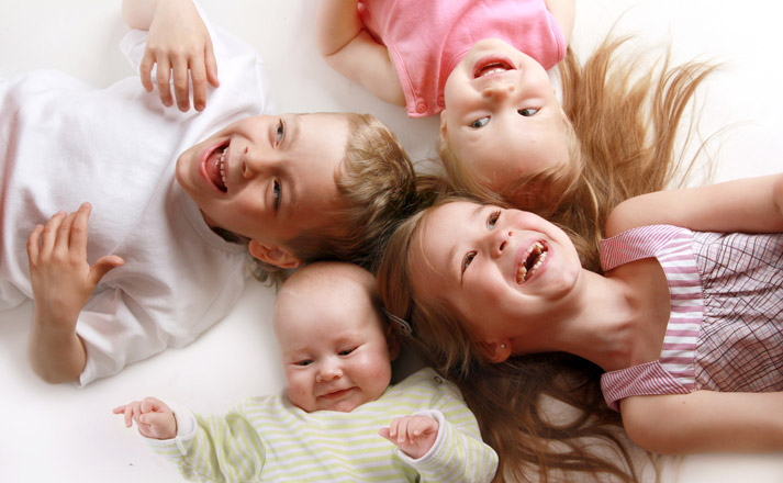 happy kids lying on the floor