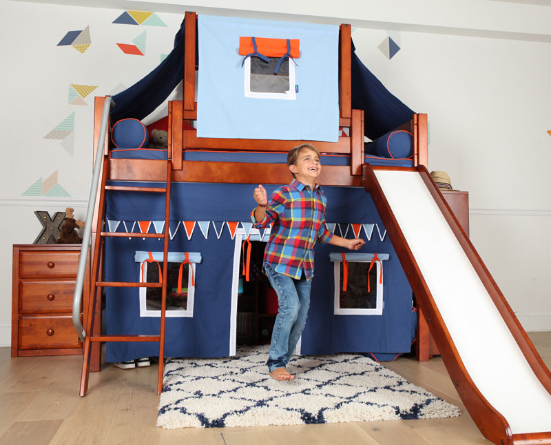 happy young boy with Maxtrix tent loft bed and slide