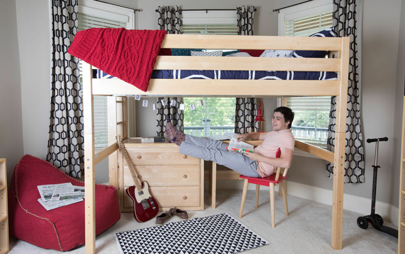 high school boy studying at Maxtrix desk located below a loft bed