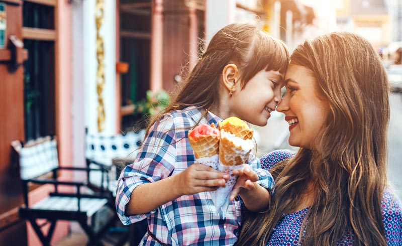 mom and daughter enjoying ice cream time