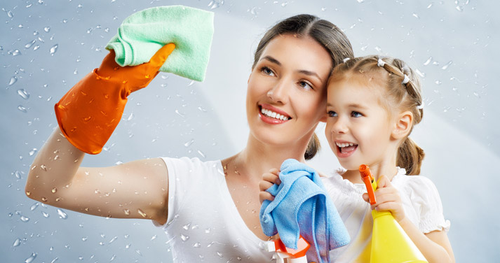 mom housecleaning together with her young daughter