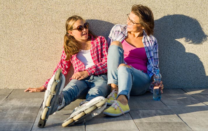 mother with roller blading teenage daughter