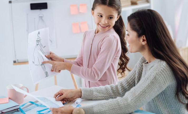 mother and daughter creating clothing designs