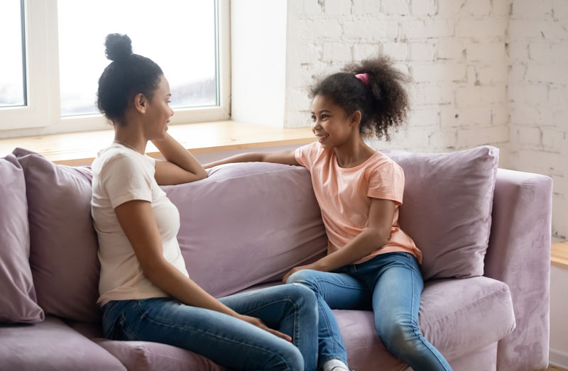 mother chatting with her teen daughter