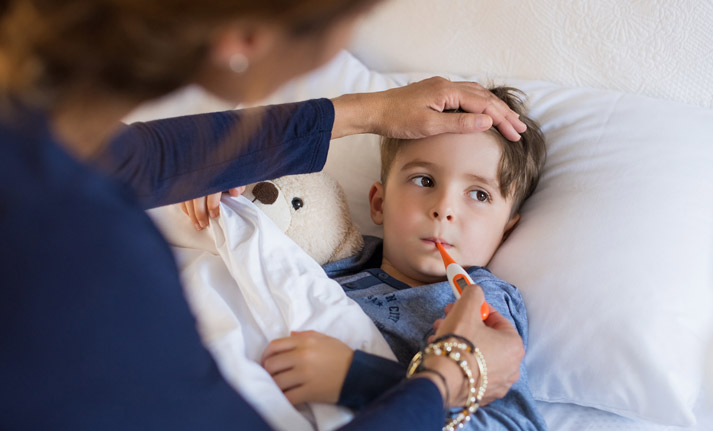 mother tending sick boy