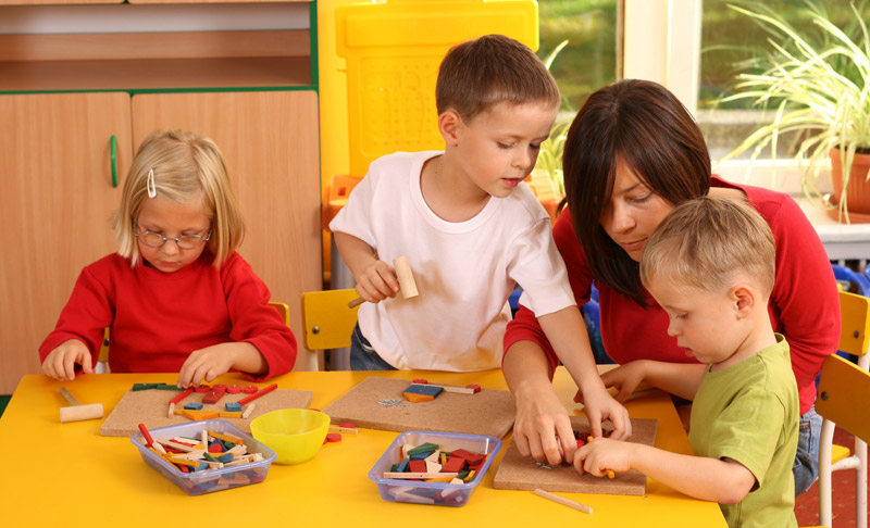 patient mother helping kids be creative