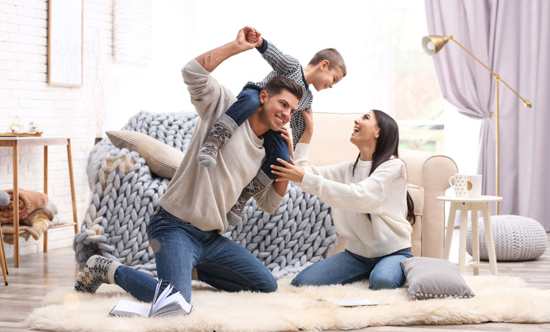 rowdy family having fun in living room