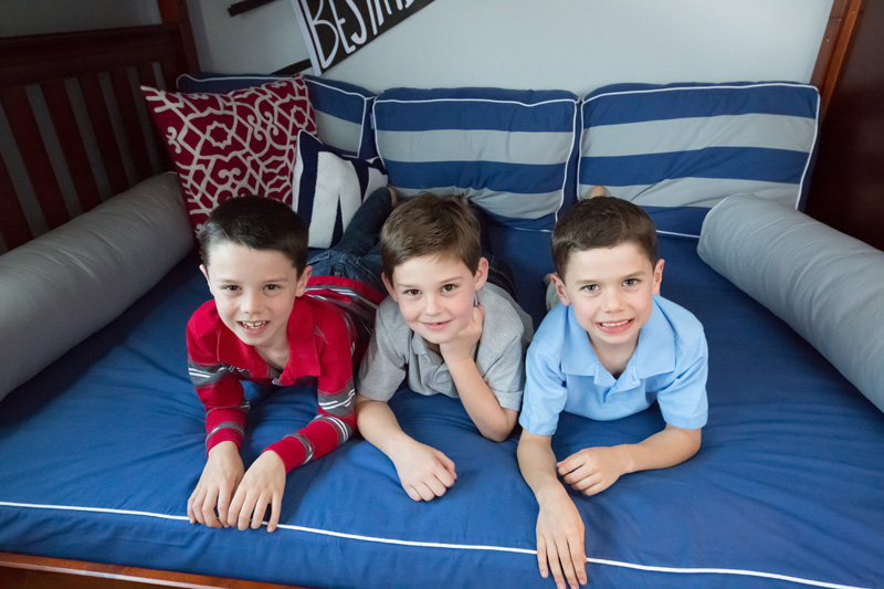 three brothers posing on Maxtrix corner loft bunk bed