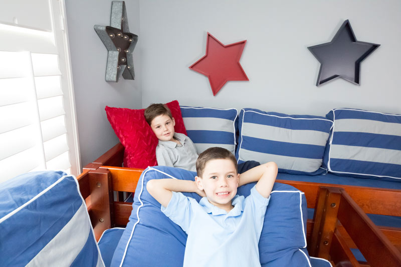 two boys resting on Maxtrix corner loft bunk bed