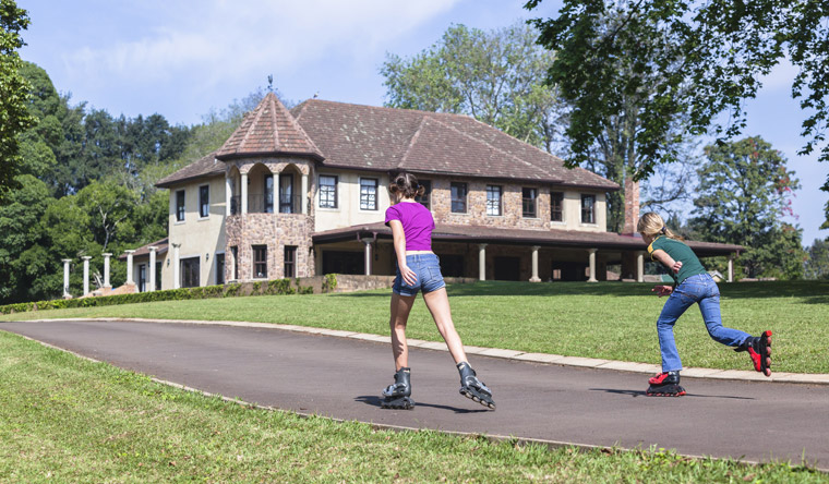 two girls rollerblading outside