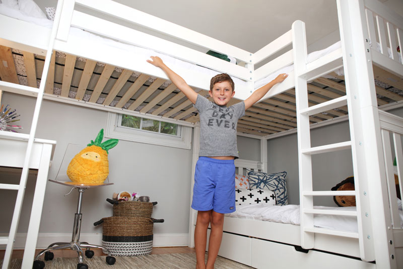 very happy boy with Maxtrix corner loft bunk bed in white finish