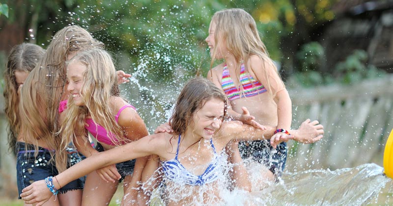 water bucket splashing group of girls