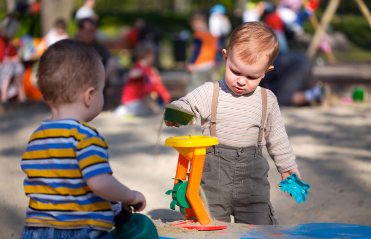 young children playing at the playground