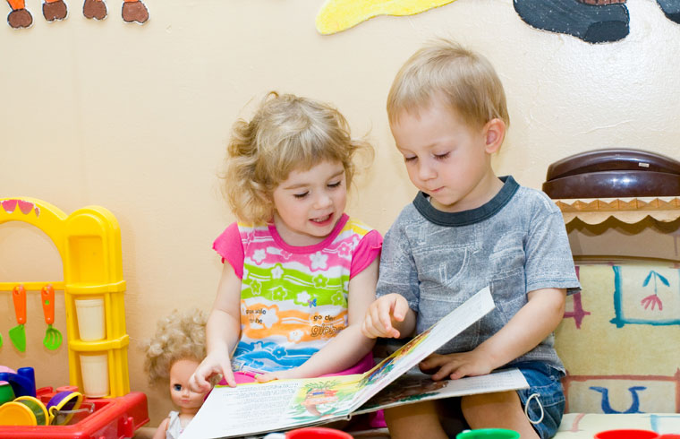 young children reading to each other