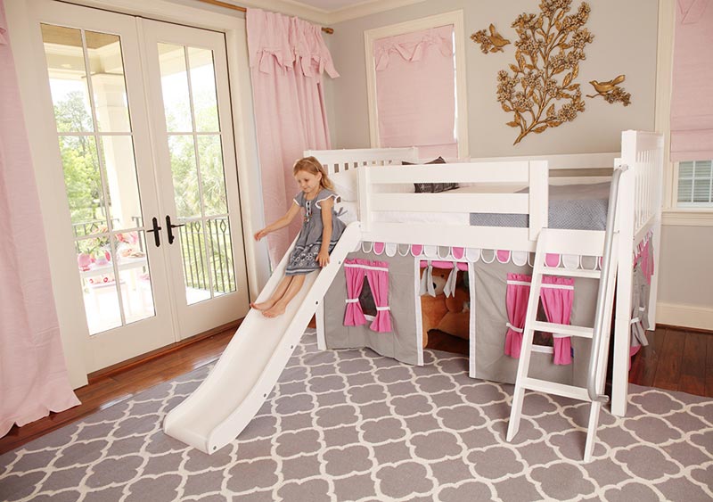 young girl sliding down a Maxtrix decorative bed