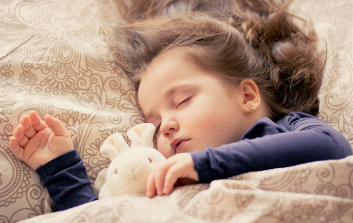 young girl soundly sleeping