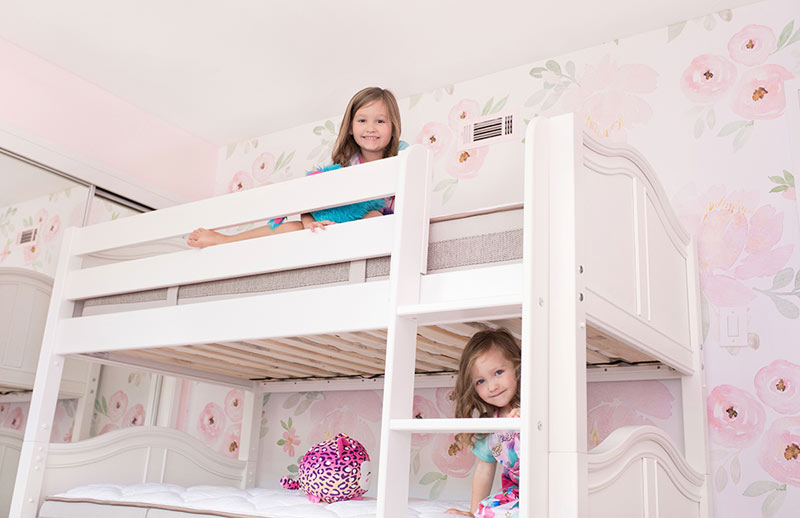 young sisters on their own bunks on a Maxtrix bunkbed